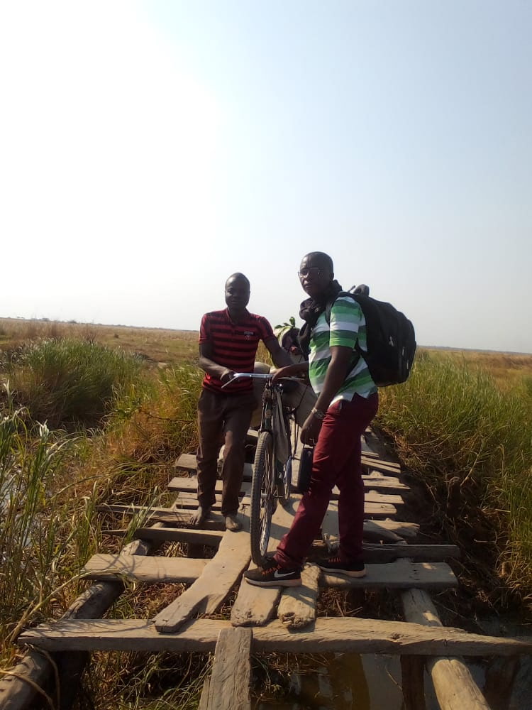 Picture of Men with bike on board road