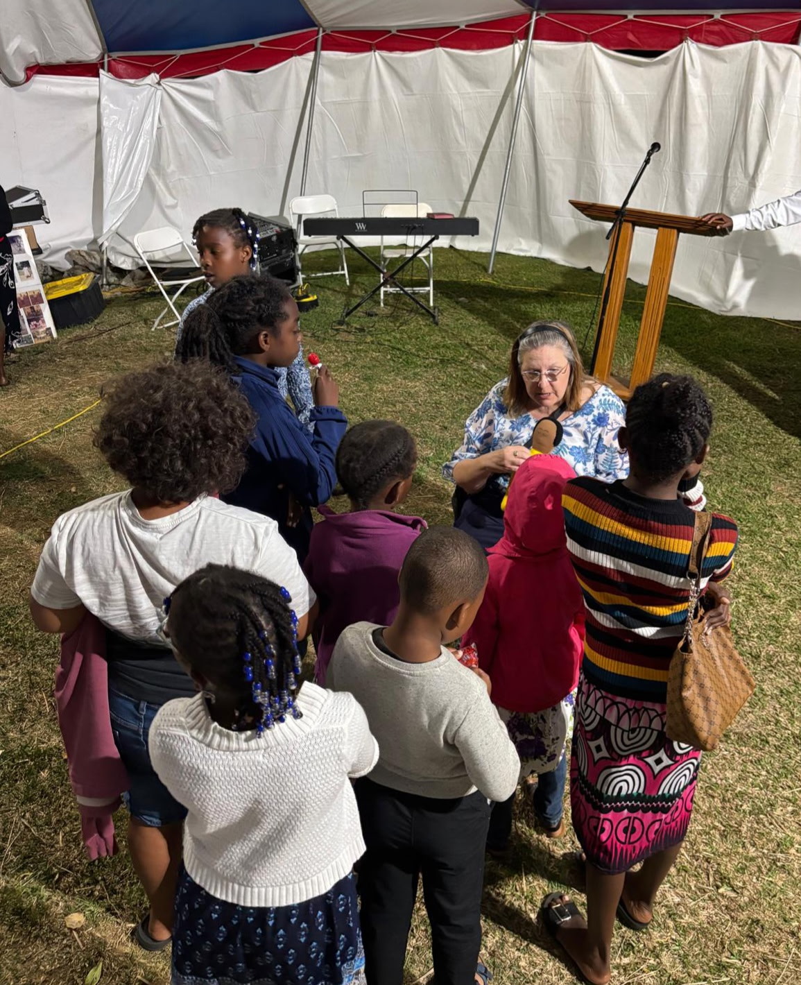 Picture of Joeth talking ot a group of children