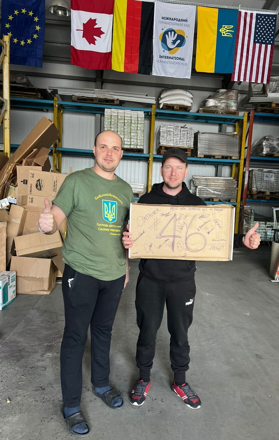 Volunteers holding up sign saying 46th container