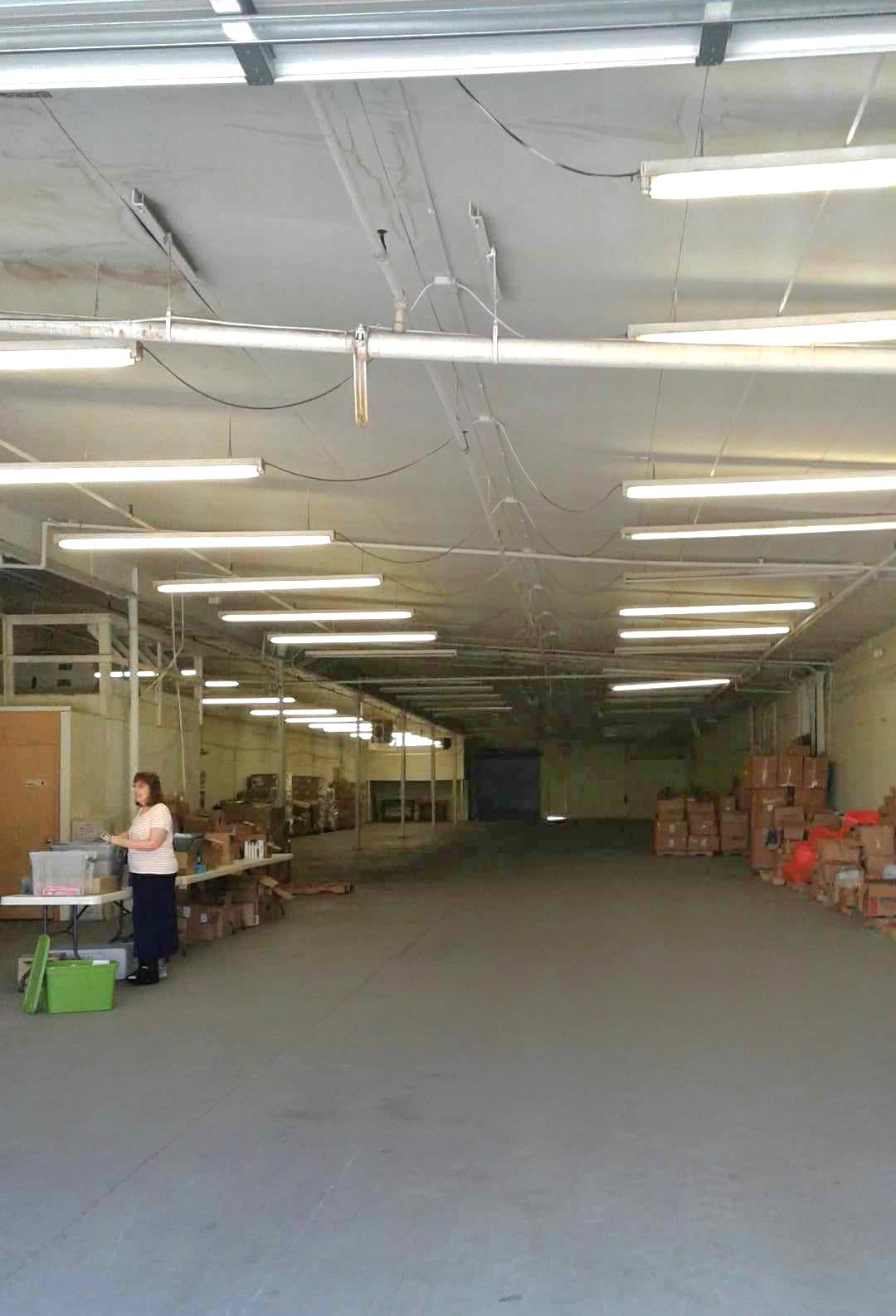 Picture of Joeth in newly acquired warehouse