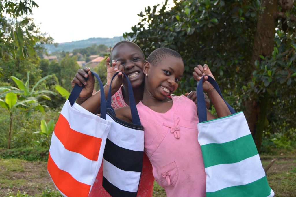 Picture of young girls holding bags made for them